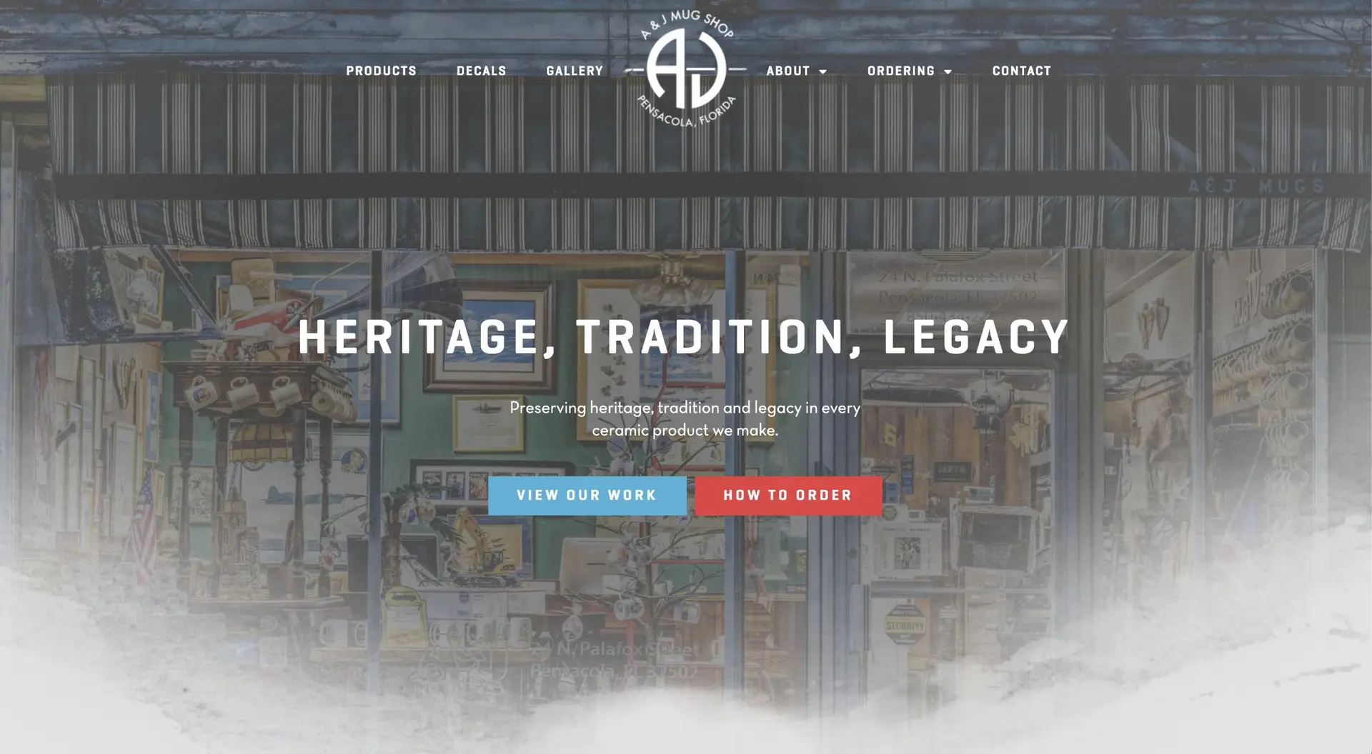 A screenshot of a ceramics company's website homepage featuring a blurred background of artisan workshop shelves filled with pottery and tools, with centered overlay text that reads "heritage, tradition, legacy.